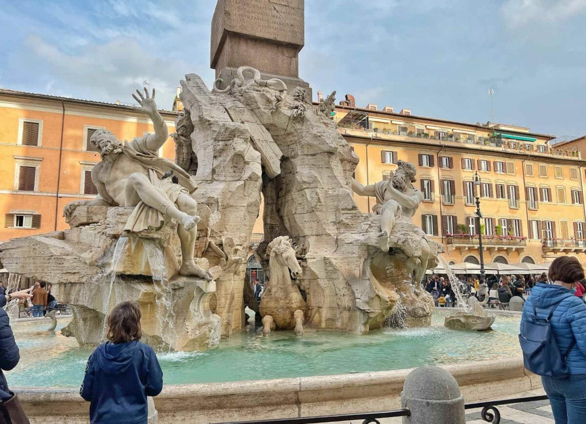 Knox standing front of a fountain at the Piazza Navona.