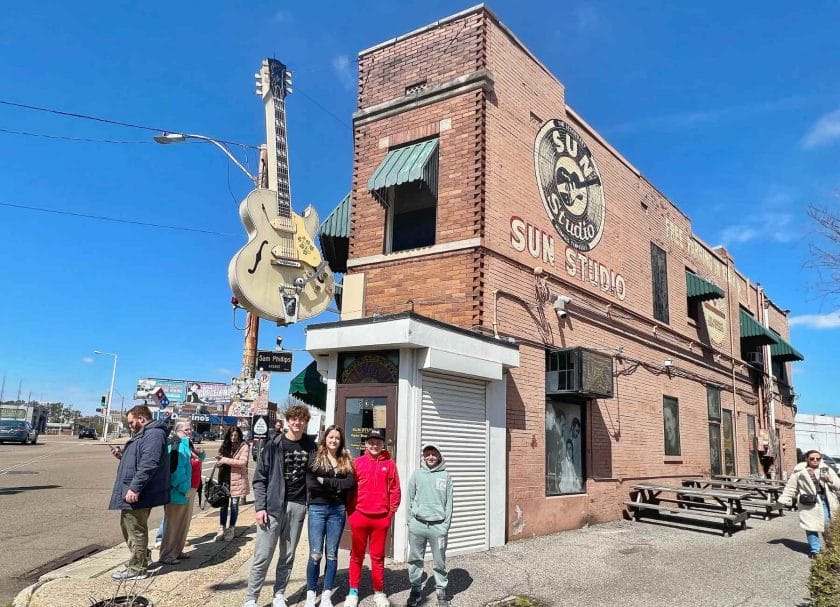 The kids standing in front of Sun Studio. 