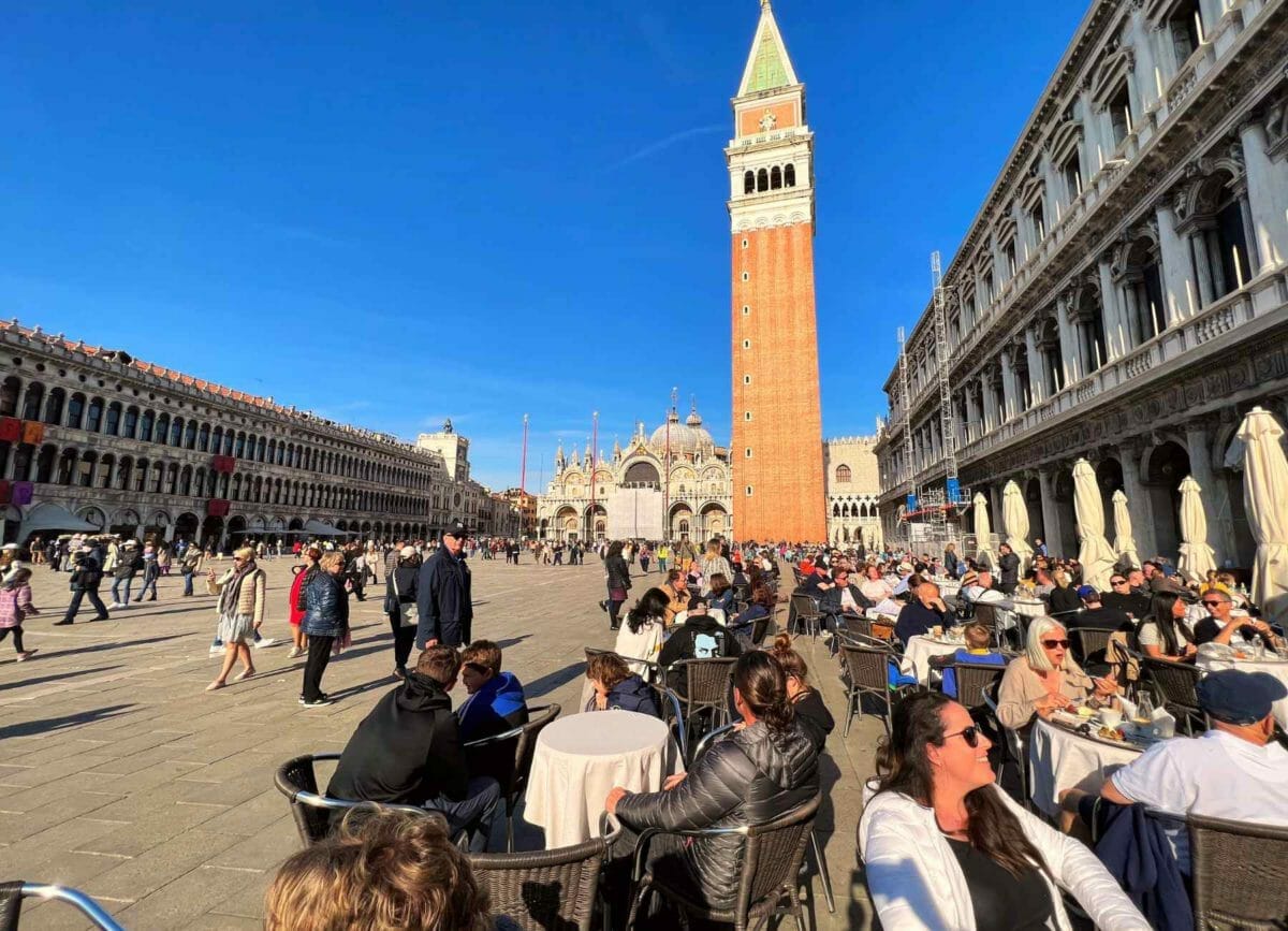 Sitting at a table in St Marks Square