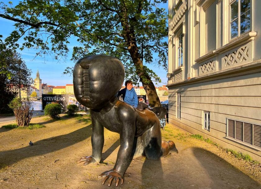 Knox on the crawling baby statue