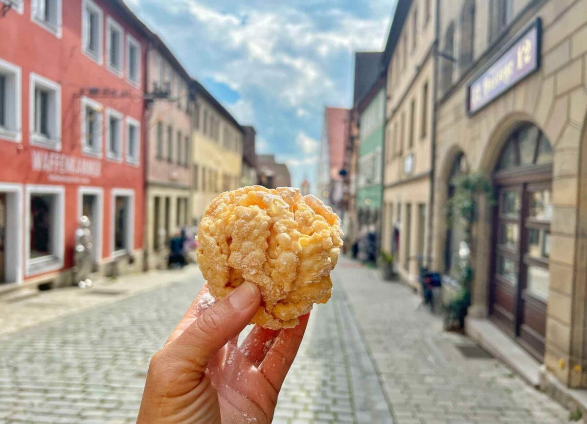 Picture of me holding a schneeball on the streets of Rothenburg.