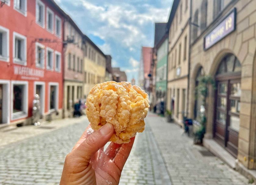 Picture of me holding a schneeball on the streets of Rothenburg.