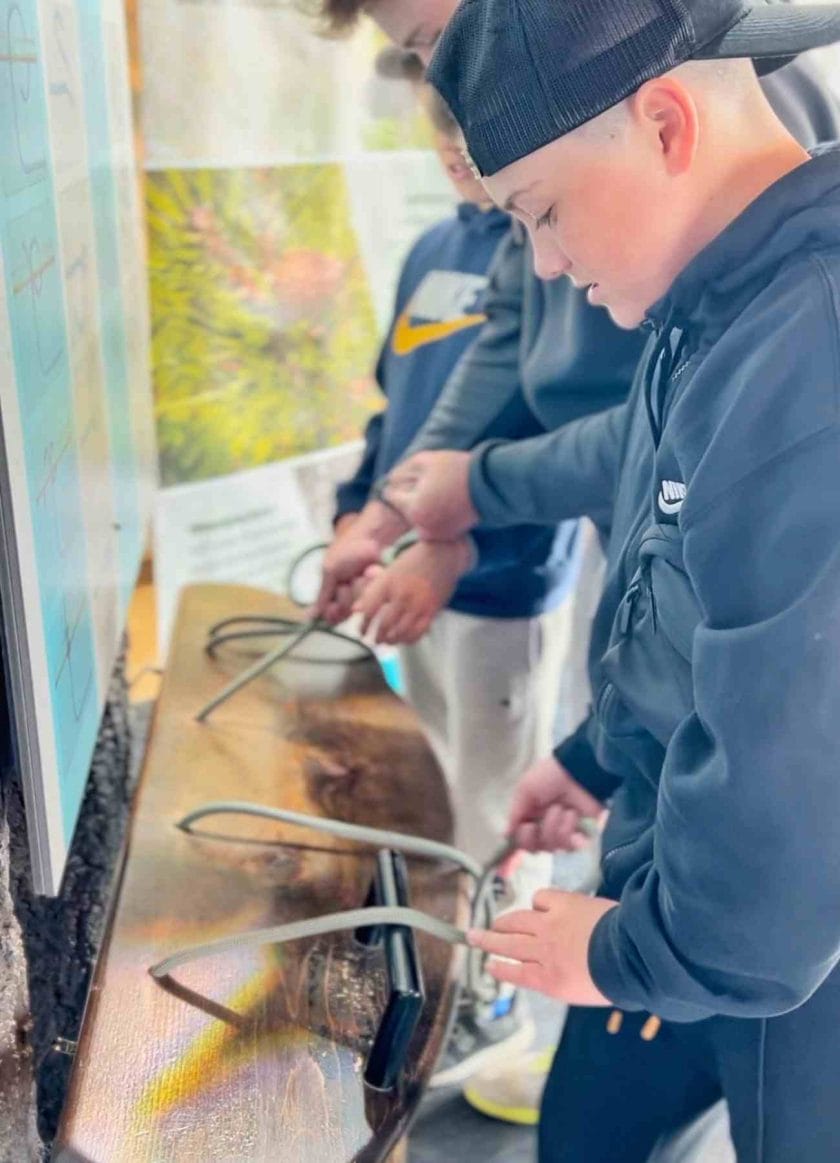 Cannon tying notes at the Banff Interpretive Center