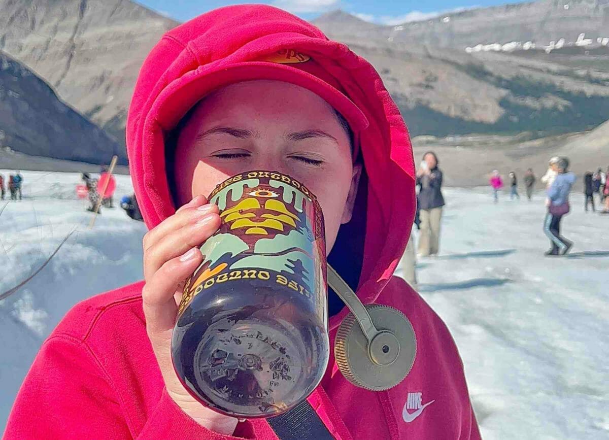 Drinking glacier water from the Athabasca Glacier