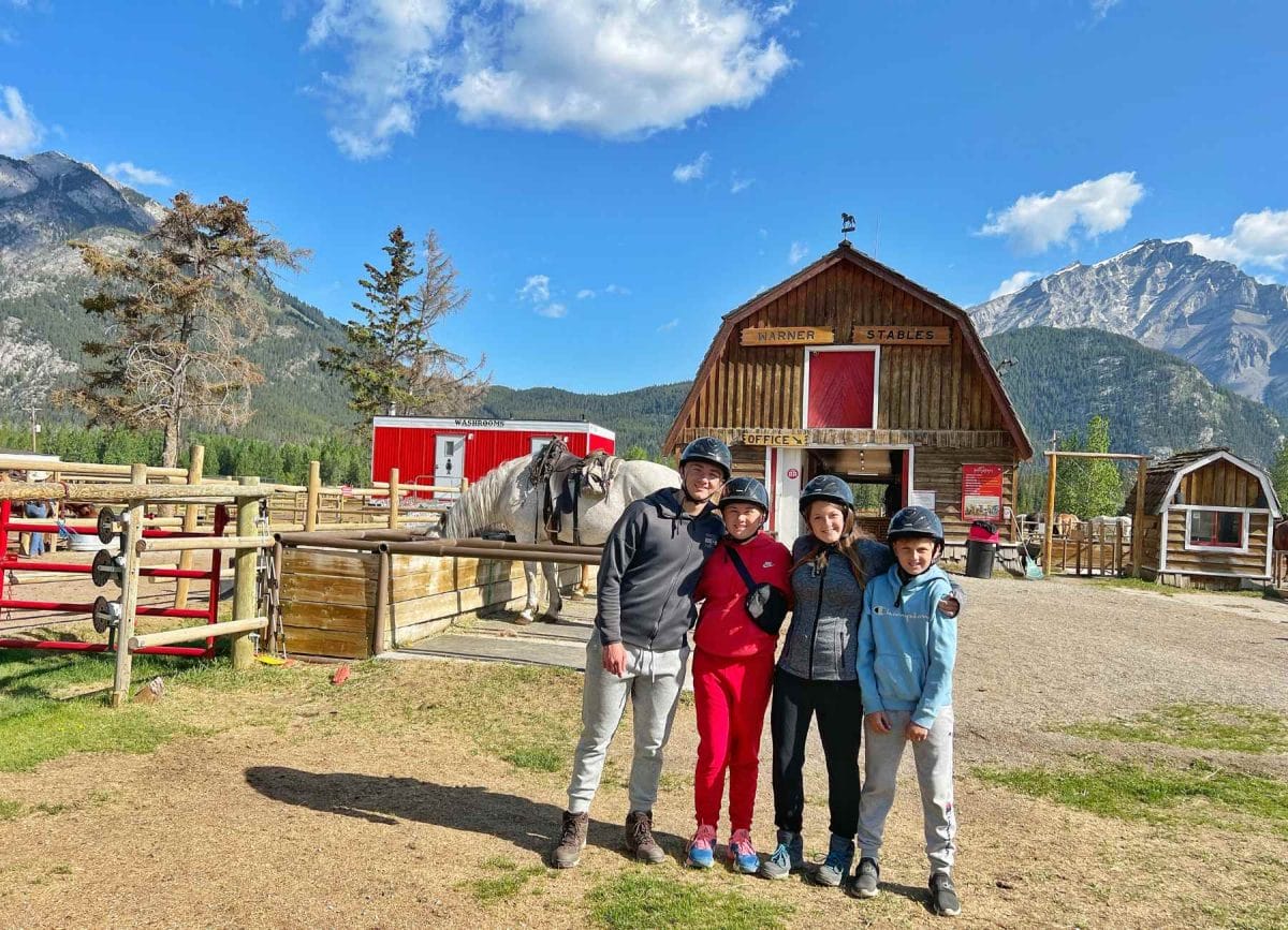 Carson, Melia, Cannon and Knox geared up and ready for horseback riding in Banff National Park