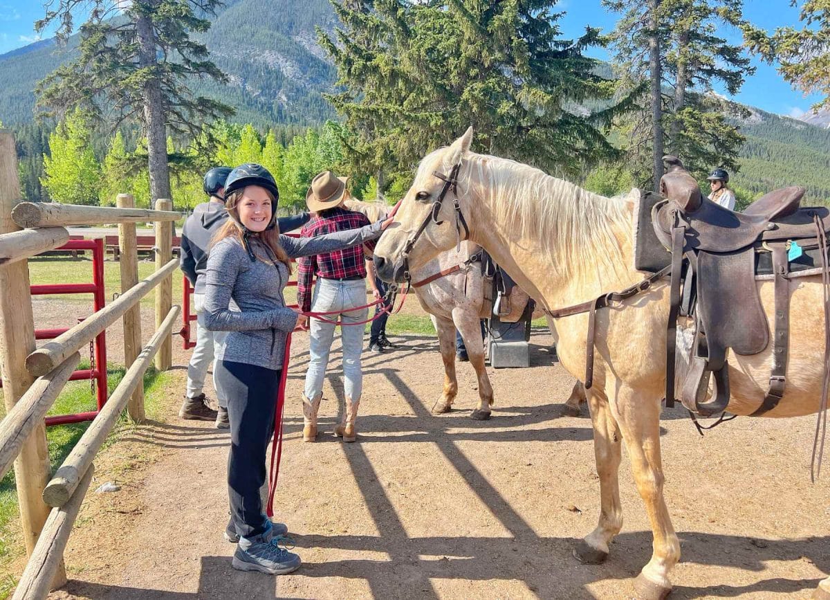 Melia with her horse while we horseback riding in Banff National park