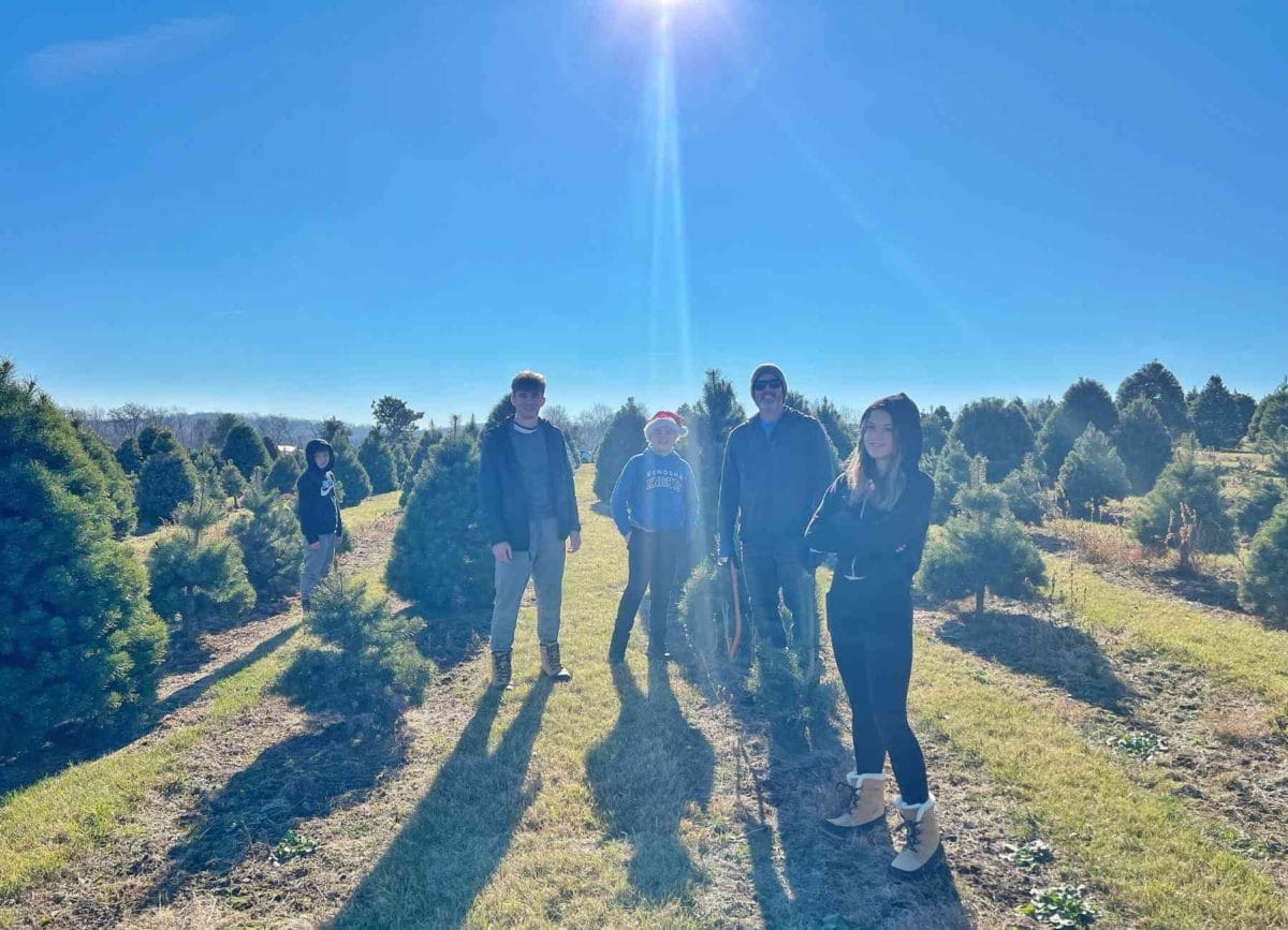 The family out looking for a Christmas tree to cut down.