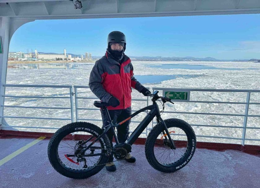 Carson with his fat bike on the ferry in Quebec City.