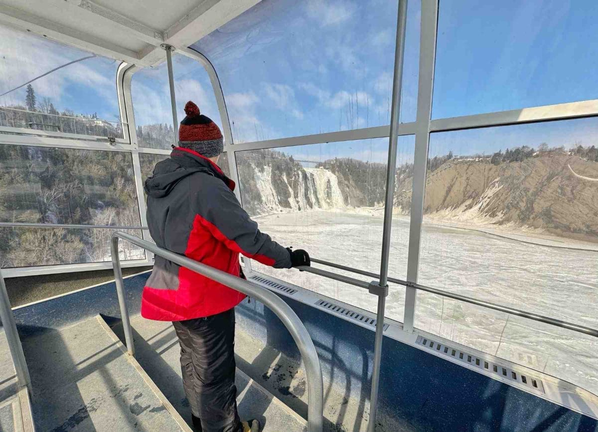 Carson in the tram looking out at the Montmorency Falls in Quebec City.