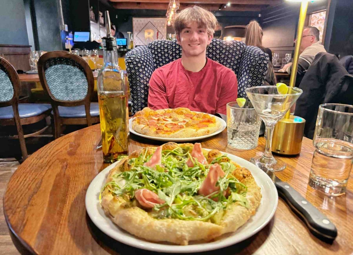 Carson and our pizzas at Raffaella Ristorante in Quebec City.