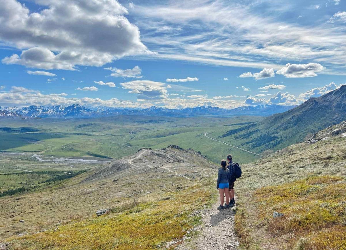 Dad and daugther looking out over Denali National Park on the Savage Ridge Trail