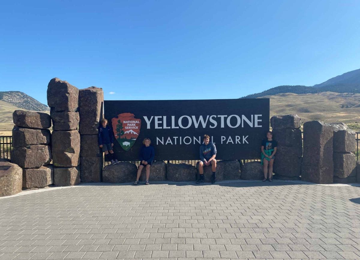 Picture in front of Yellowstone National Park Sign