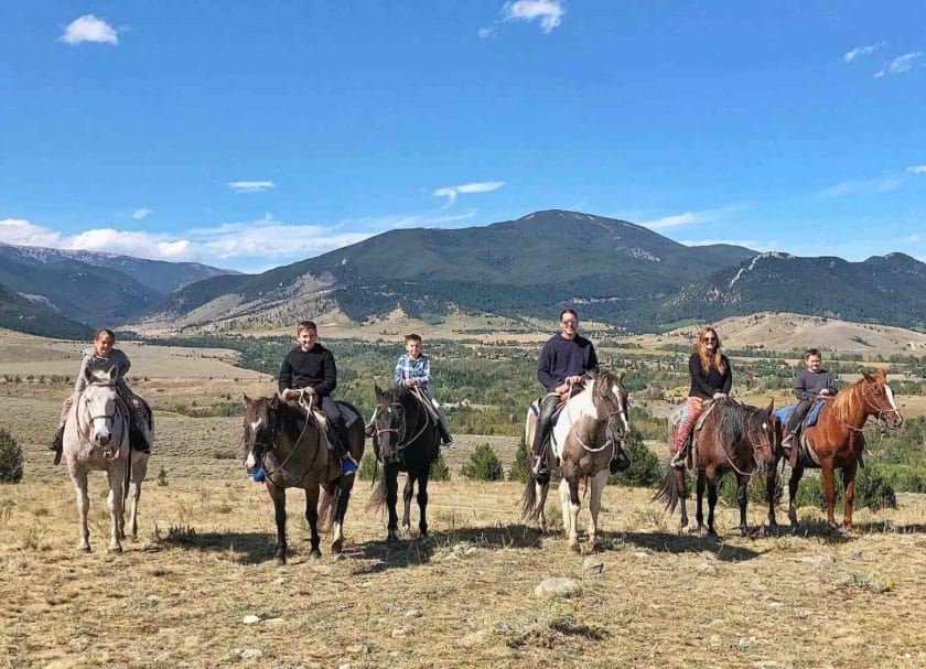 Picture of our family horseback riding in Montana