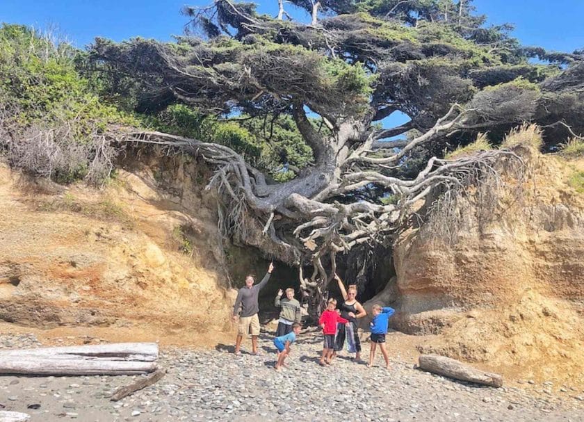 Picture of our family pointing at the Tree of Life on the Washington Coast