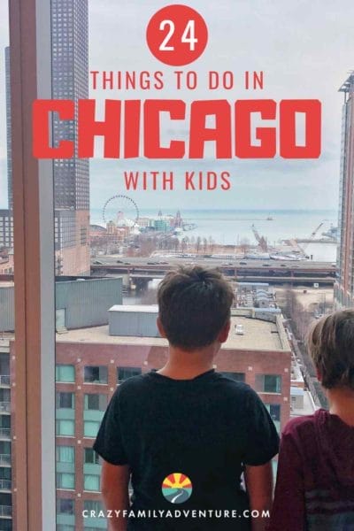 Kids looking out hotel window at Navy Pier in Chicago